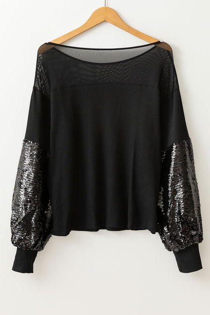 Schwarze Bluse mit Pailletten-Patchwork und Laternenärmeln