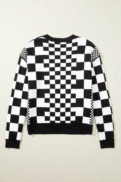 Schwarzer Pullover mit Karomuster und überschnittener Schulterpartie und Rundhalsausschnitt