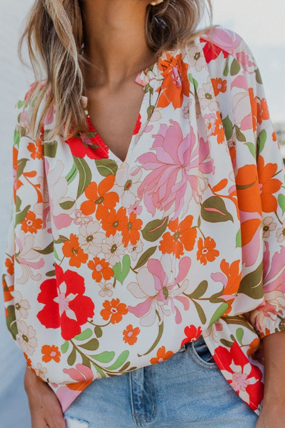 Orangefarbene Bluse mit Puffärmeln und Rüschenbesatz