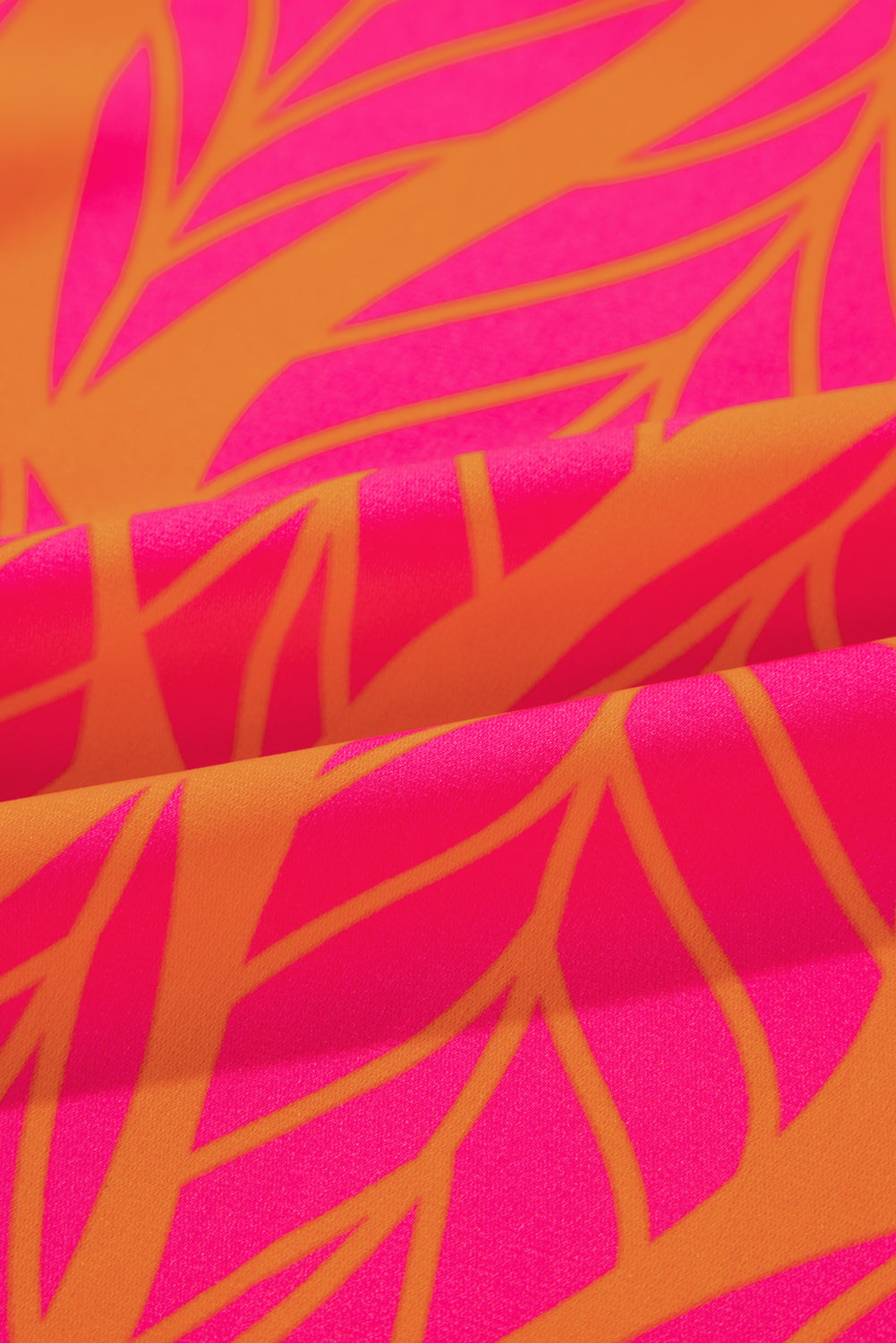 Rose – Bluse mit gesmokten Puffärmeln und tropischem Blattmuster