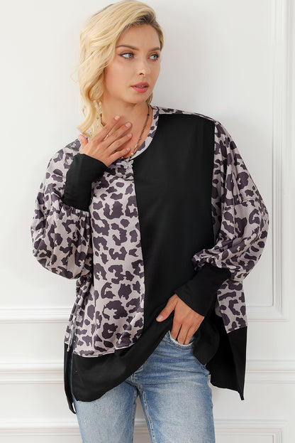 Schwarzes Sweatshirt mit Leoparden-Patchwork und Schlitzen im Bischofsärmel-Stil