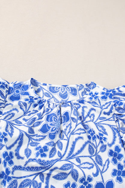 Dunkelblaue Bluse mit Blumenmuster und Rüschen und Puffärmeln