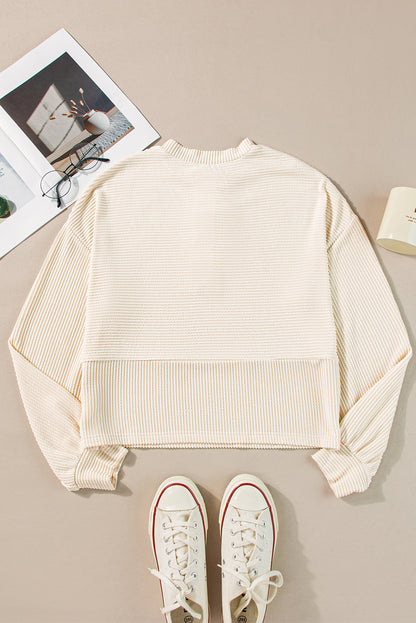 Aprikosenfarbenes Henley-Sweatshirt mit Kordelstruktur, Laternenärmeln und Knöpfen
