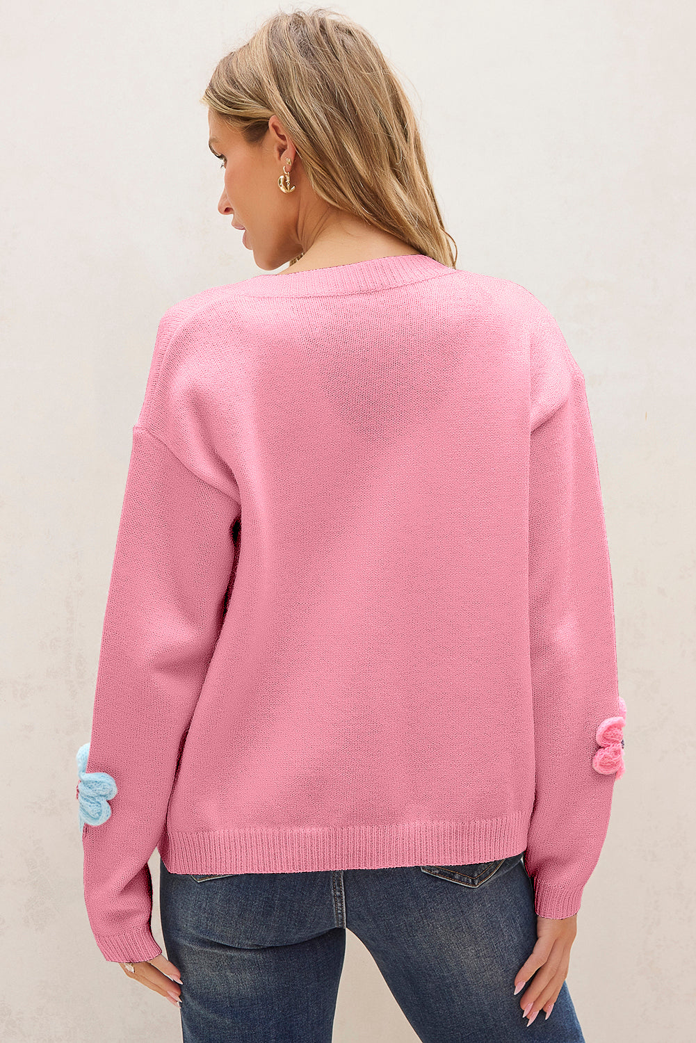 Niedliche Strickjacke mit Blumenmuster in Rosa