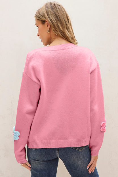 Niedliche Strickjacke mit Blumenmuster in Rosa