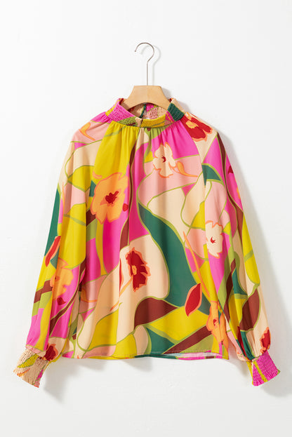 Bluse mit mehrfarbigem Blumenmuster, gesmoktem Saum und Stehkragen