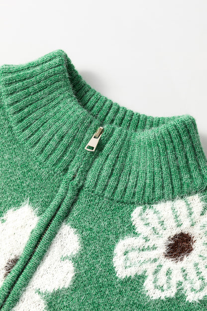 Grüner Pullover mit Blumenmuster und halblangem Reißverschluss sowie überschnittenen Schultern