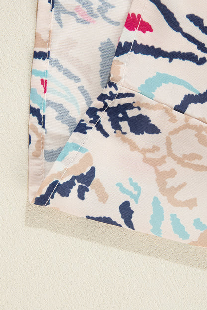 Weiße Bluse mit abstraktem Print und V-Ausschnitt, geschlitzten Halbarm
