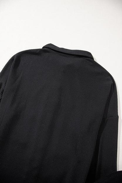 Schwarzes Shacket mit Kordel und aufgesetzter Brusttasche mit Pailletten