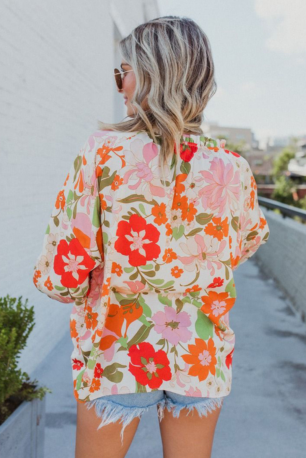 Orangefarbene Bluse mit Puffärmeln und Rüschenbesatz