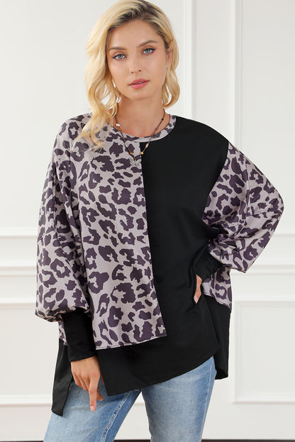 Schwarzes Sweatshirt mit Leoparden-Patchwork und Schlitzen im Bischofsärmel-Stil